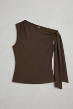 a dark brown asymmetric one-shoulder sleeveless top with subtle neck gathering and a draped tie detail on the left shoulder