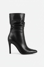 Black high-heeled boot on a white background