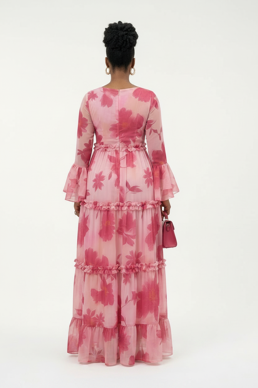 Person wearing a pink floral dress on a white background 