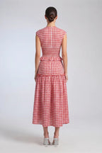 women wearing the a red gingham midi dress.