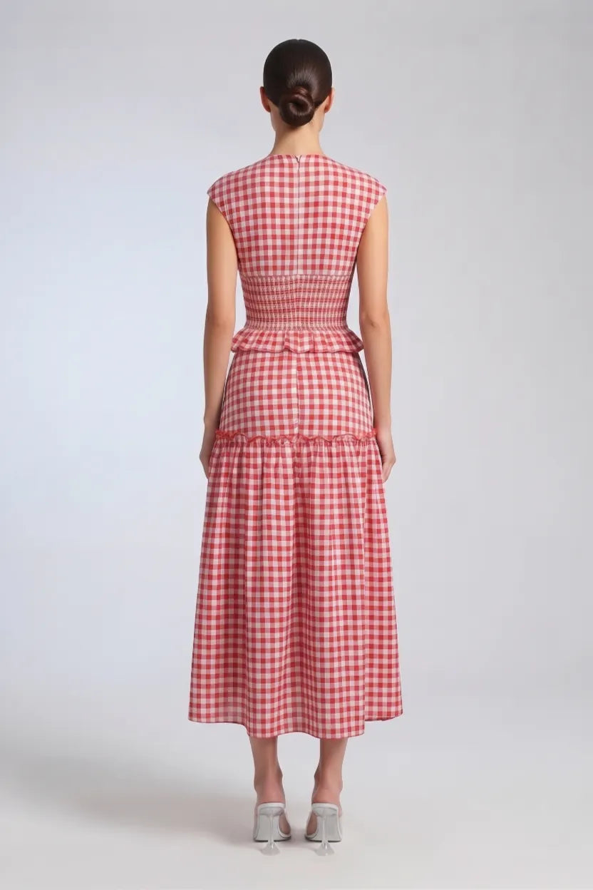 women wearing the a red gingham midi dress.
