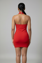 Woman wearing a red dress with a neutral background