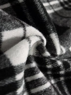 Close-up of a textured fabric with black and white stripes