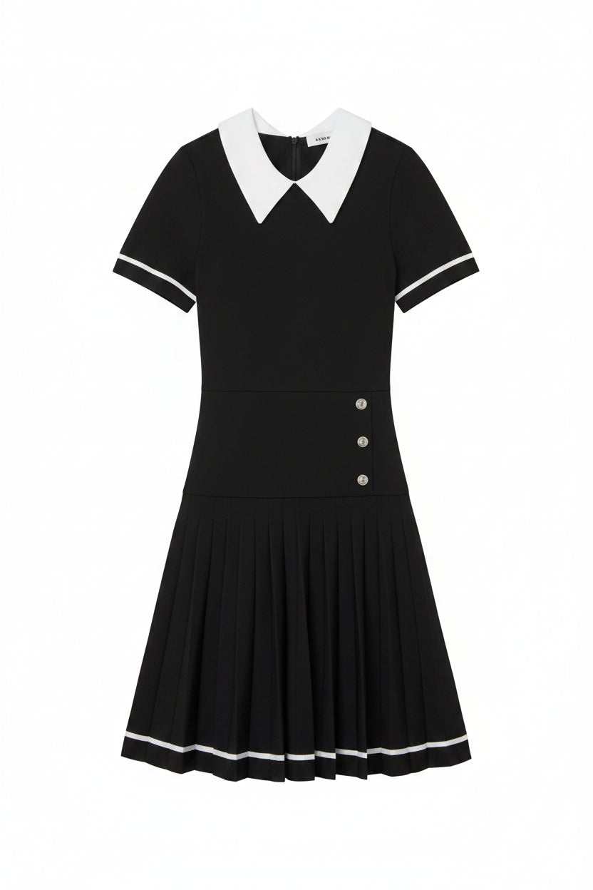 Black dress with white collar and buttons on a light gray background