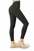 Black leggings worn by a person on a white background
