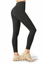 Black leggings worn by a person on a white background