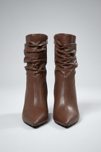 Pair of brown leather boots on a white background