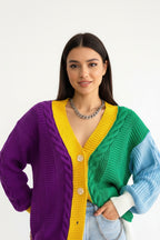 Colorful cardigan with purple, yellow, and green sections worn by a person.