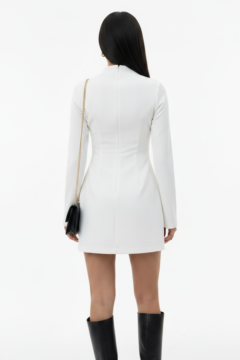 Person wearing a white dress with long sleeves on a white background