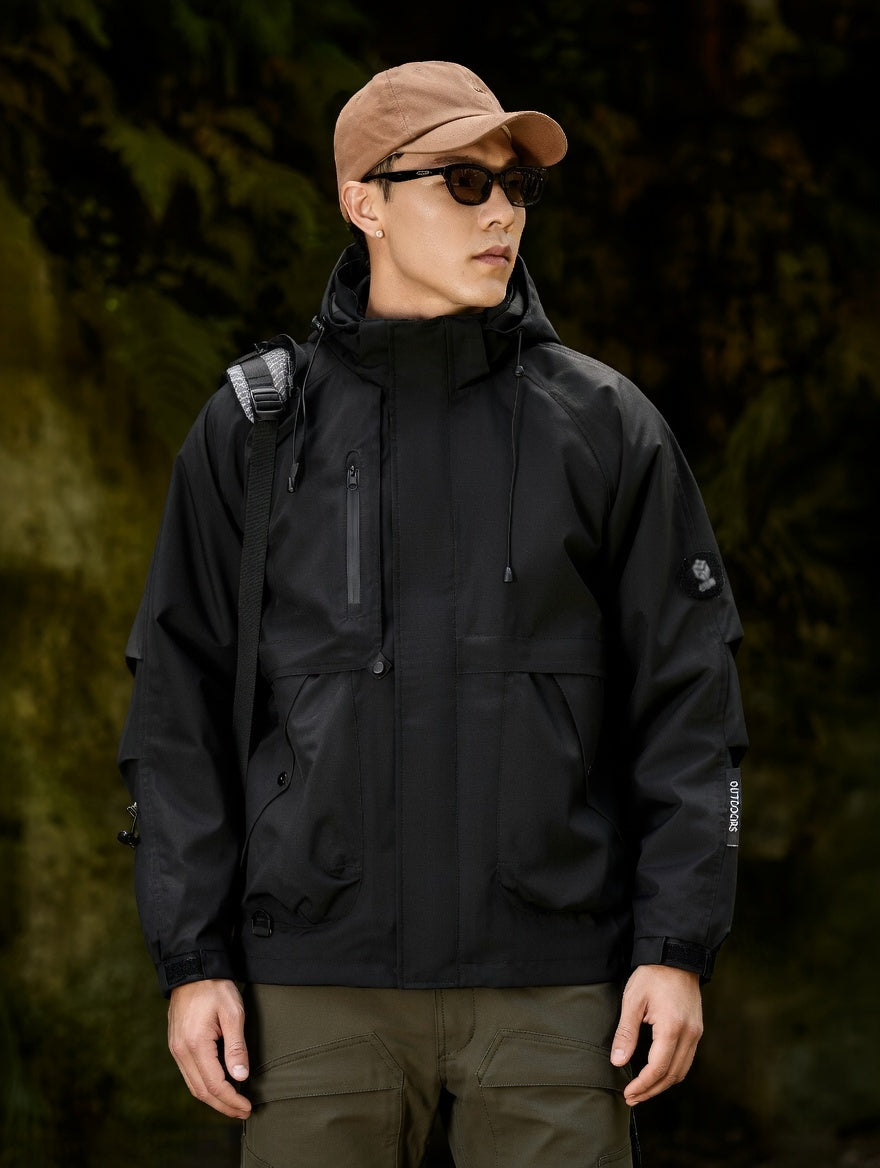 Person wearing a black jacket and brown cap in a forest setting