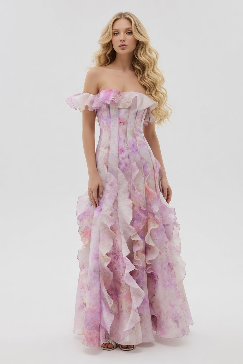 Woman wearing a floral off-shoulder gown on a white background