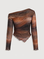 a long-sleeved, one-shoulder top is crafted from a sheer, lightweight mesh fabric featuring an abstract, smoky watercolor print in rich tones of warm rust orange, deep brown, and muted charcoal. The fitted, asymmetrical design features soft all-over ruching that contours the body, complemented by a sleek one-shoulder neckline and a uniquely curved, lettuce-edge hemline