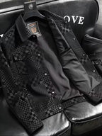 Black and gray checkered jacket on a hanger with 'LOVE' text in the background