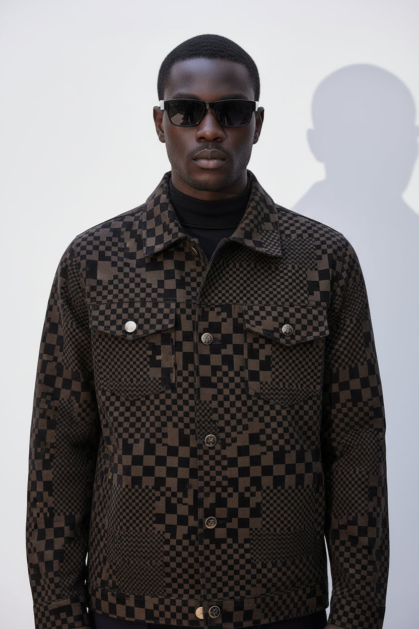 Man wearing a checkered jacket and sunglasses against a white background