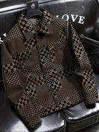 Checkered jacket on a black leather seat with visible brand logo.