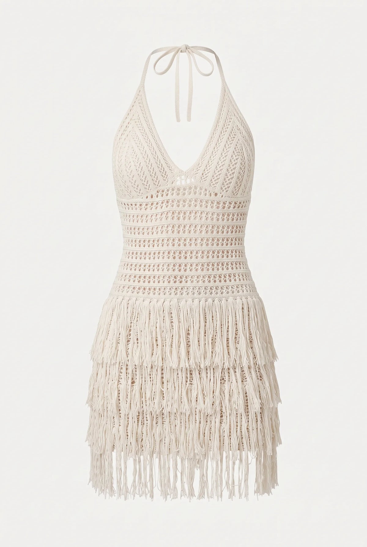 An off-white crochet halter mini dress with a tiered fringe hem, shown against a plain white background.
