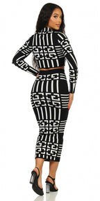 Woman wearing a black and white geometric patterned outfit on a white background