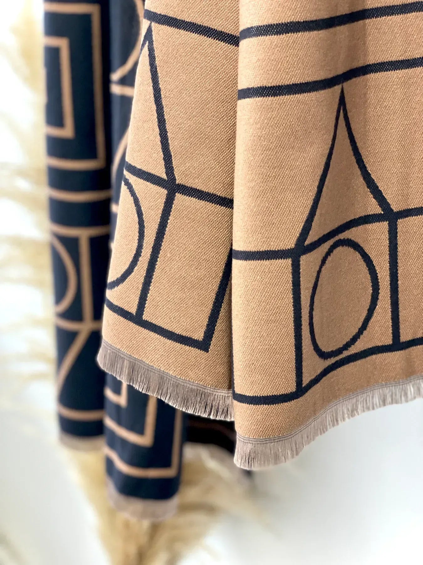 Beige and navy patterned fabric with geometric designs