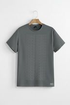 Gray t-shirt with 'HOLY SPIRIT' text on a hanger against a light gray background