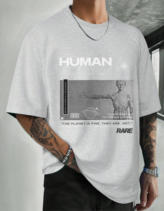 Person wearing a gray t-shirt with a graphic design and text.