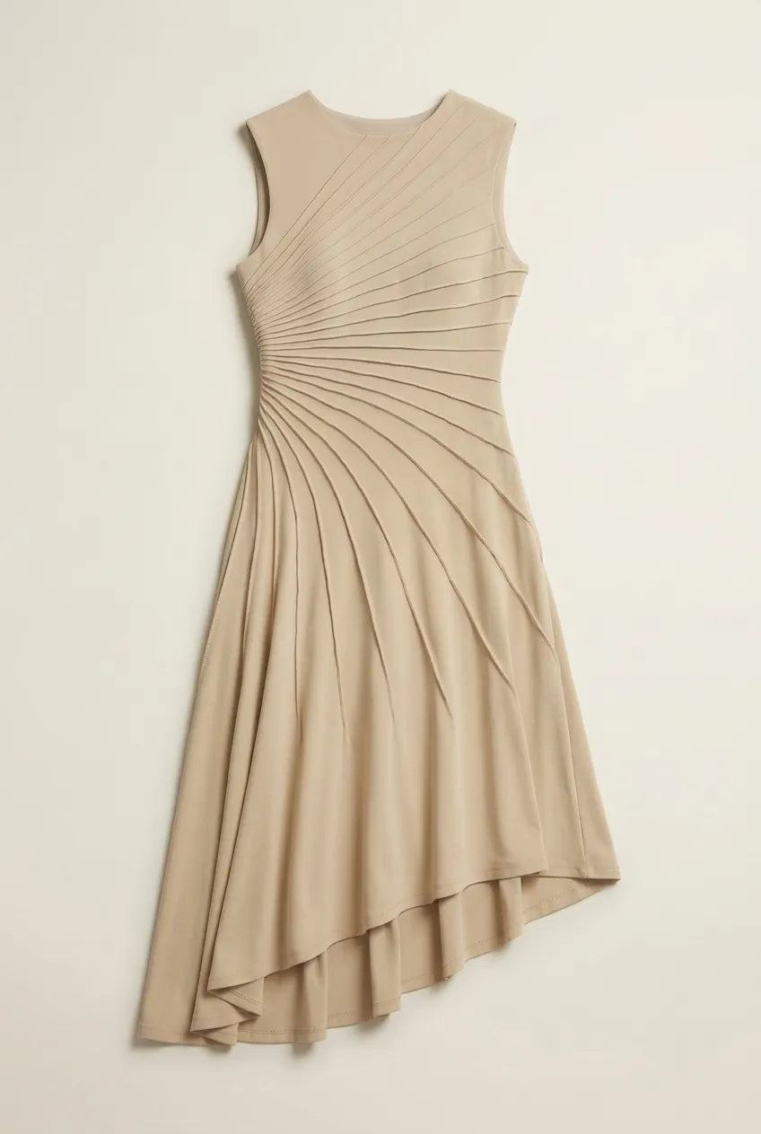 This sleeveless, beige midi dress features a crew neckline and a sophisticated sunray pin-tuck design that radiates outward across the fitted bodice. Crafted from a fluid, medium-weight fabric, the dress forms structural pleated lines that extend downward through an A-line silhouette, culminating in a dramatic asymmetrical high-low hemline that flows gracefully around the legs.