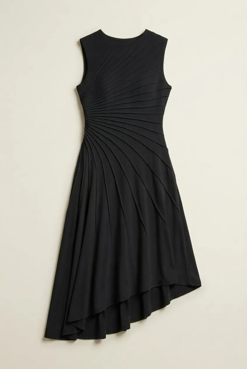 This sleeveless, black midi dress features a crew neckline and a sophisticated sunray pin-tuck design that radiates outward across the fitted bodice. Crafted from a fluid, medium-weight fabric, the dress forms structural pleated lines that extend downward through an A-line silhouette, culminating in a dramatic asymmetrical high-low hemline that flows gracefully around the legs.