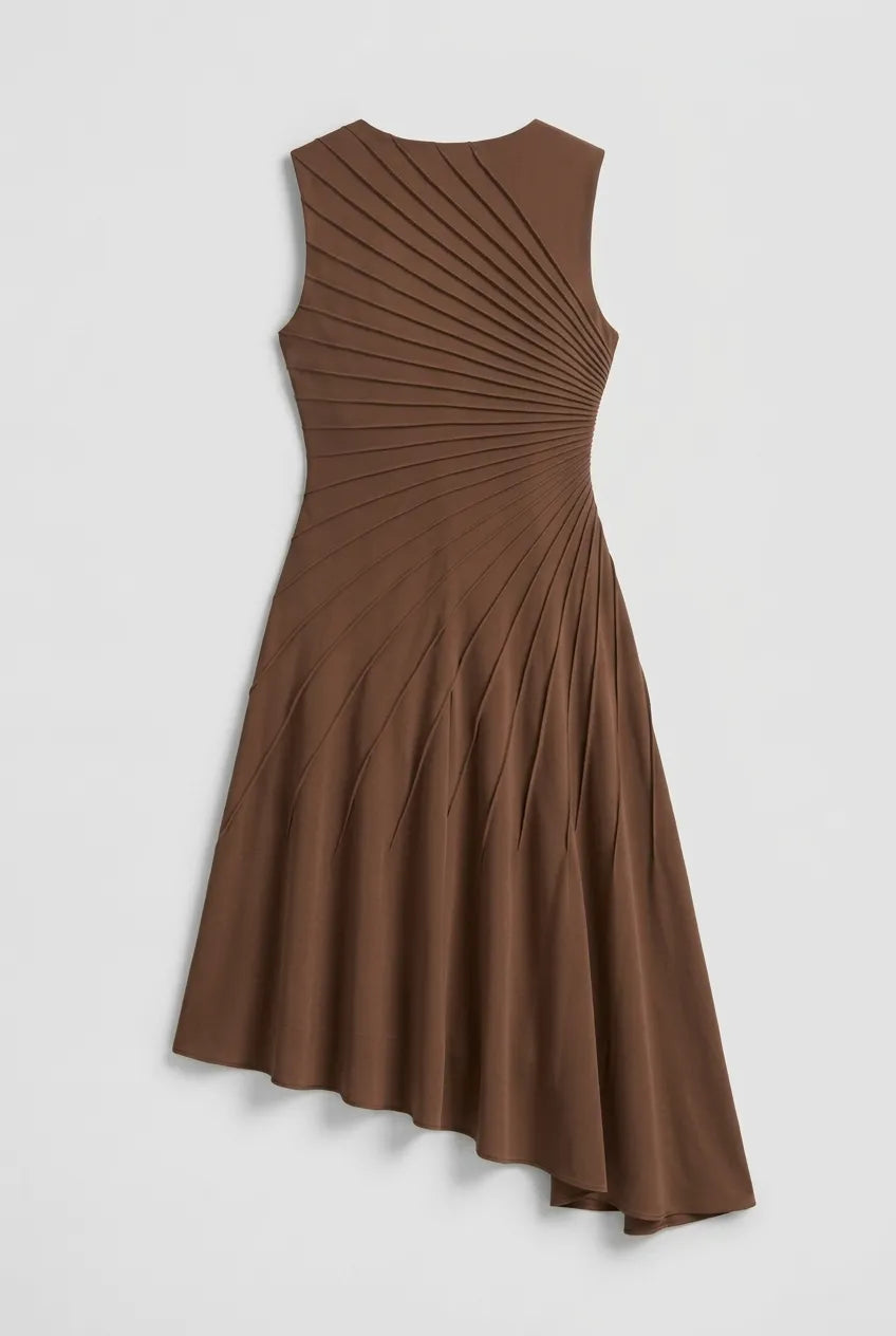 This sleeveless, brown midi dress features a crew neckline and a sophisticated sunray pin-tuck design that radiates outward across the fitted bodice. Crafted from a fluid, medium-weight fabric, the dress forms structural pleated lines that extend downward through an A-line silhouette, culminating in a dramatic asymmetrical high-low hemline that flows gracefully around the legs.