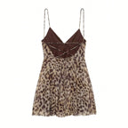Leopard print dress with brown top on a white background