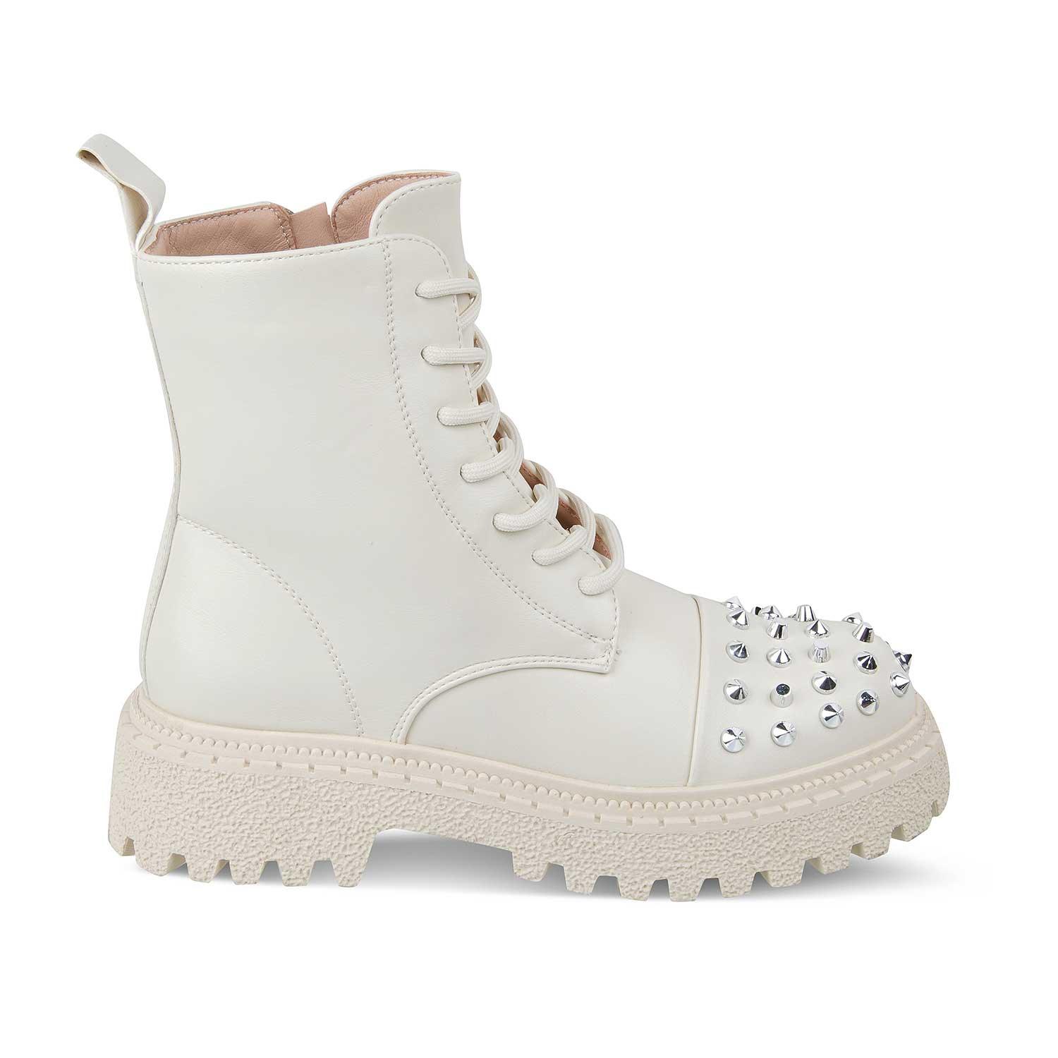 White boot with studded details on a white background