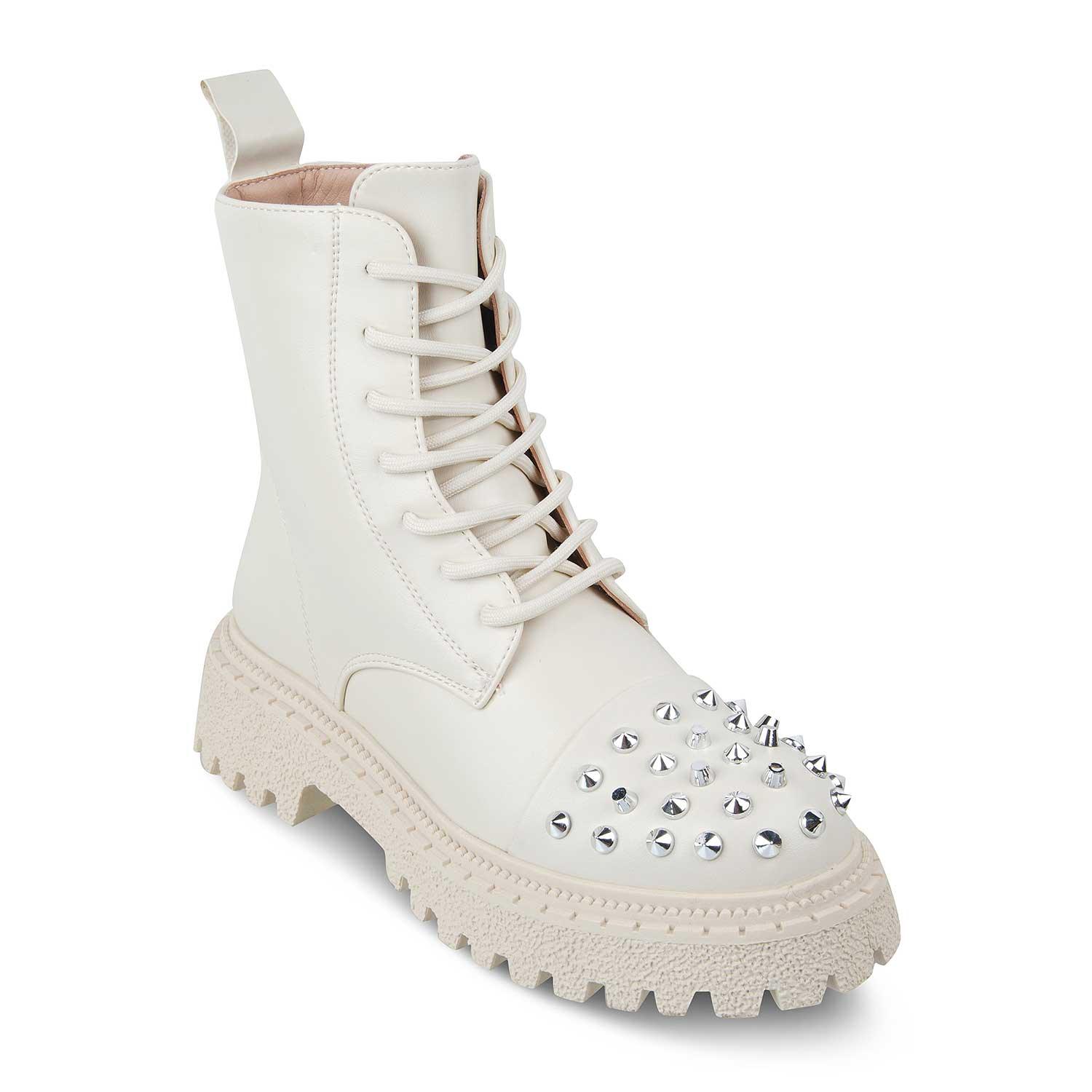 White combat boot with studded details on a white background