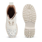 White sneaker with rhinestone details on a white background