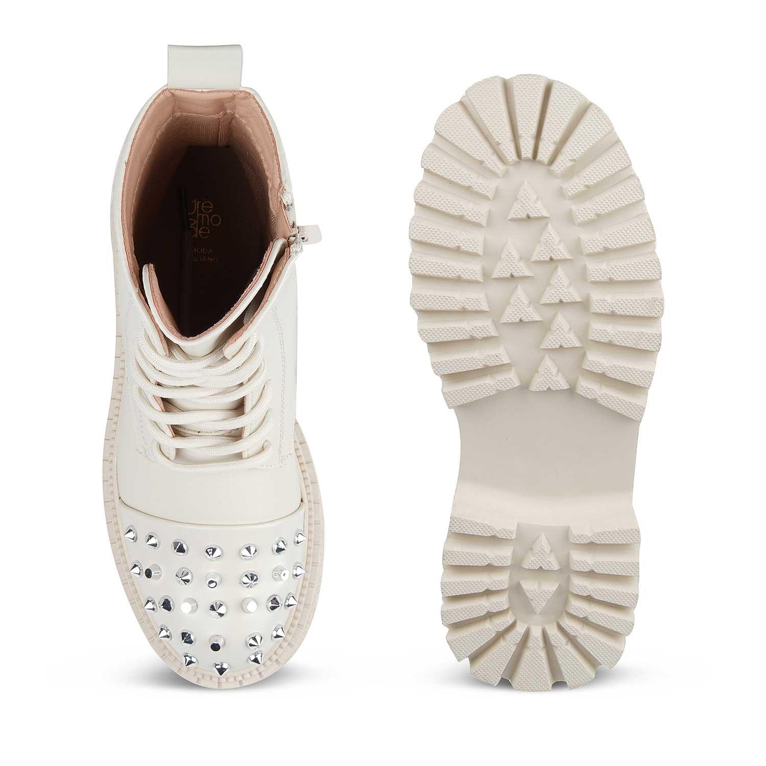 White sneaker with rhinestone details on a white background