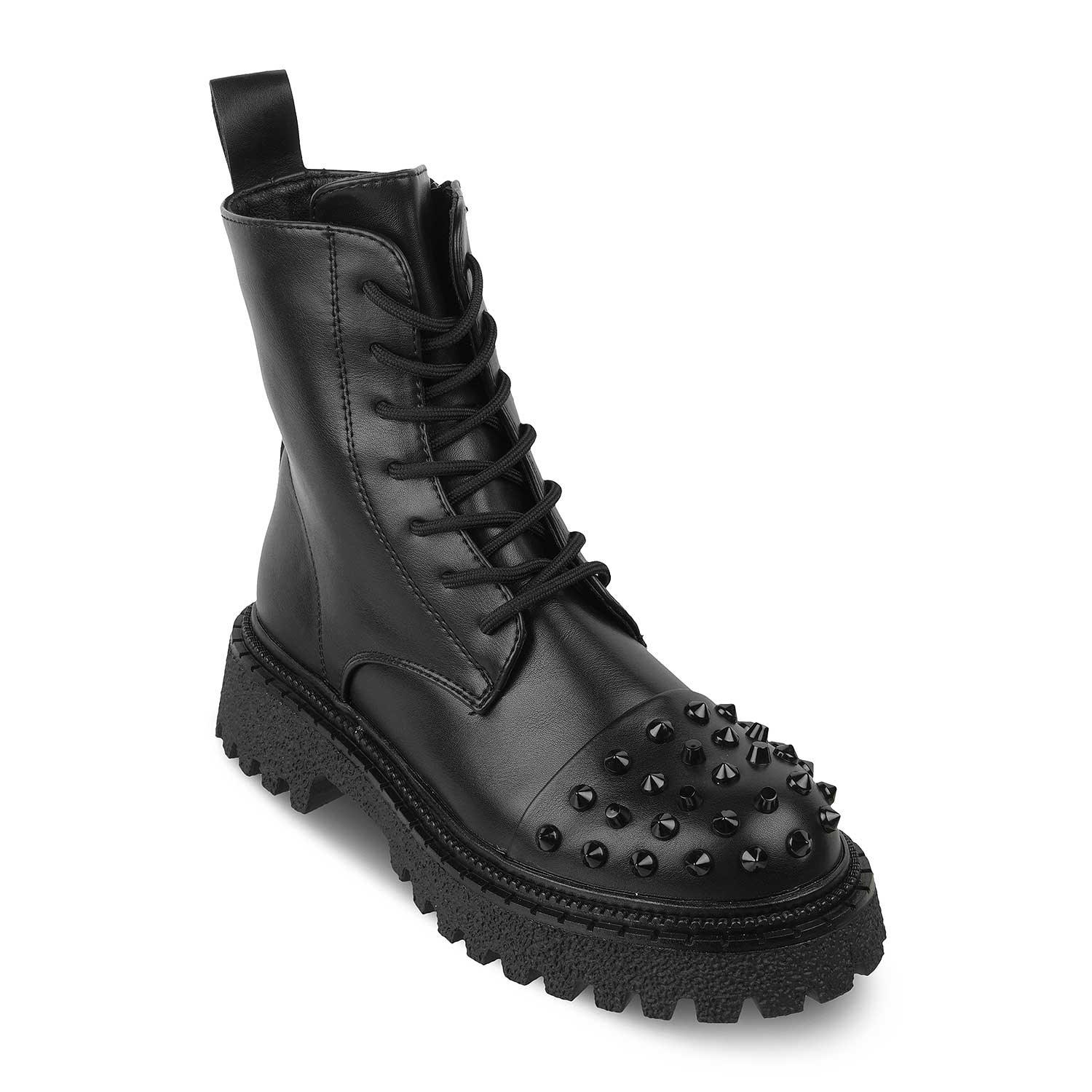 Black leather boot with studded details on a white background