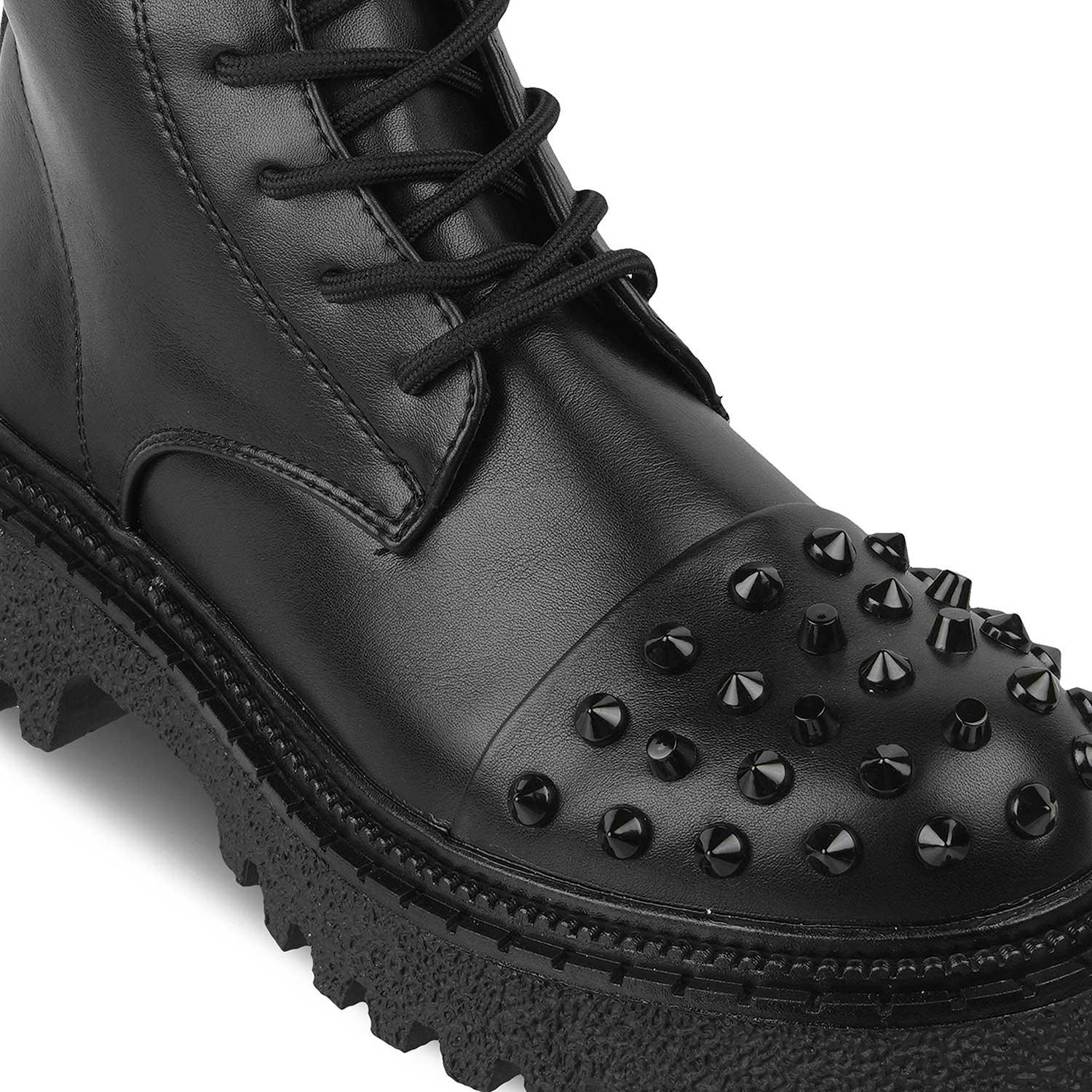 Black leather boot with studded details on a white background