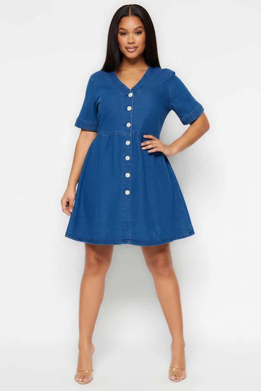Woman wearing a blue denim dress with a white background