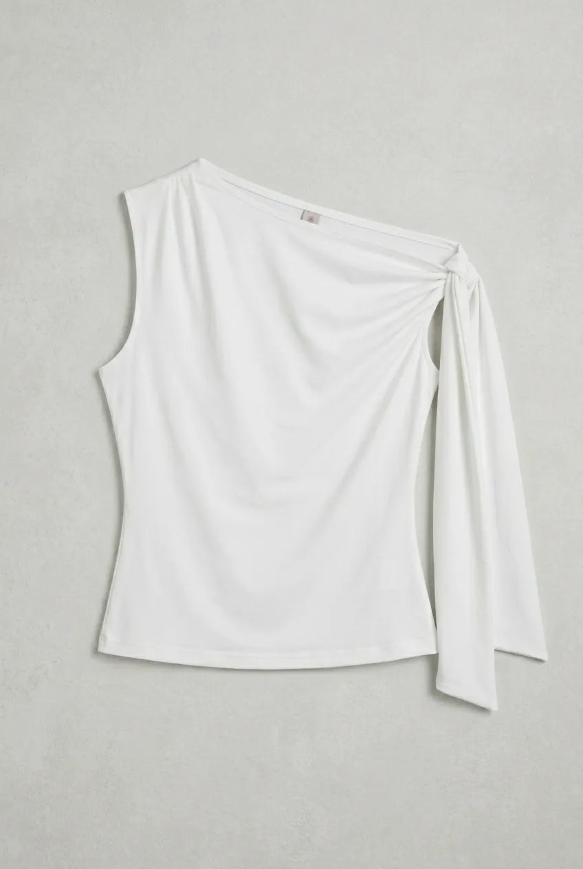 a white asymmetric one-shoulder sleeveless top with subtle neck gathering and a draped tie detail on the left shoulder