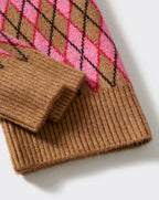 Brown knitted sweater with pink and black argyle pattern on a white background