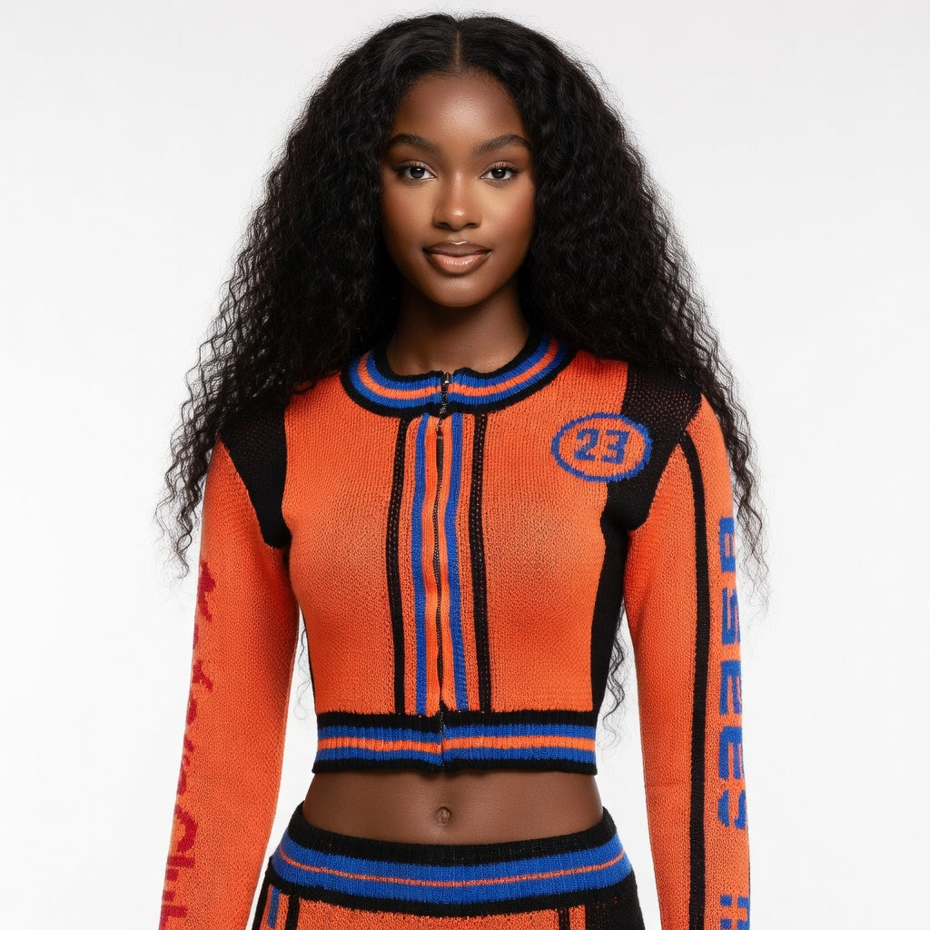 Woman wearing an orange and blue sweater with number 23 on a white background